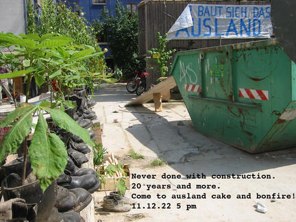 picture of ausland yard 20 years ago, with plants and a construction site sign